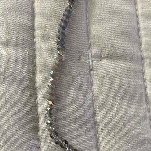 Tiny beaded necklace.